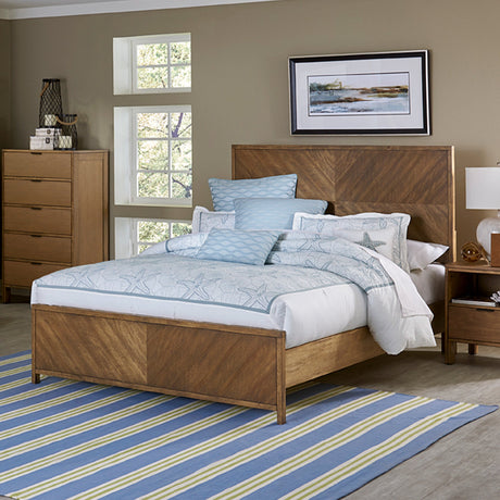 Queen bed with pillows and blankets