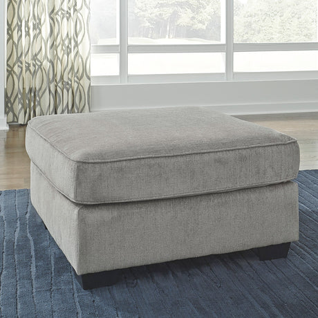Gray upholstered ottoman