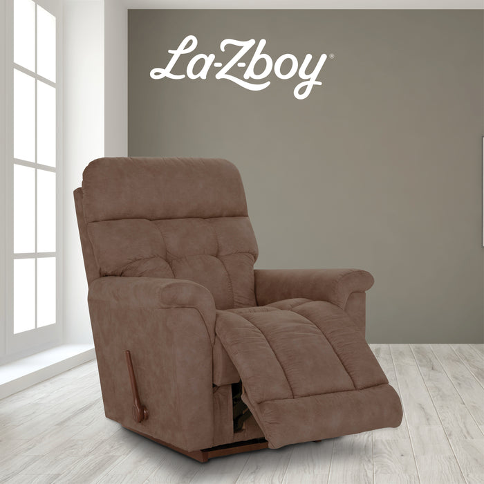 Brown La-Z-Boy recliner chair in a room with a gray wall and large window.