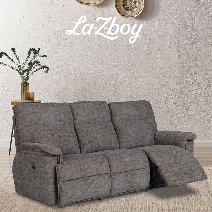 Gray reclining sofa with 'La-Z-Boy' branding in a room setting.