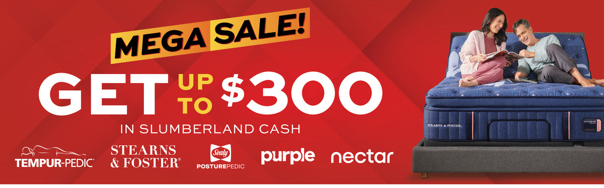 Promotional banner for a mattress sale, featuring a blue mattress on a bed frame with two people lying on it against a red background with large text reading 'MEGA SALE! GET UP TO $300 IN SLUMBERLAND CASH' and mattress brand logos at the bottom.