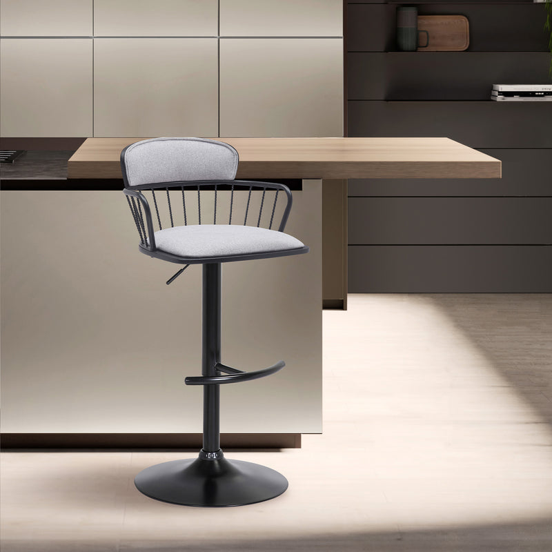 Nash Adjustable Swivel Bar Stool in a modern kitchen beside a counter.