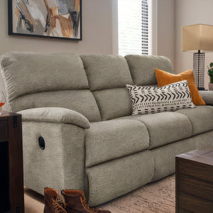 Gray sofa with decorative pillows in a living room setting