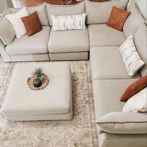 White sectional with ottoman