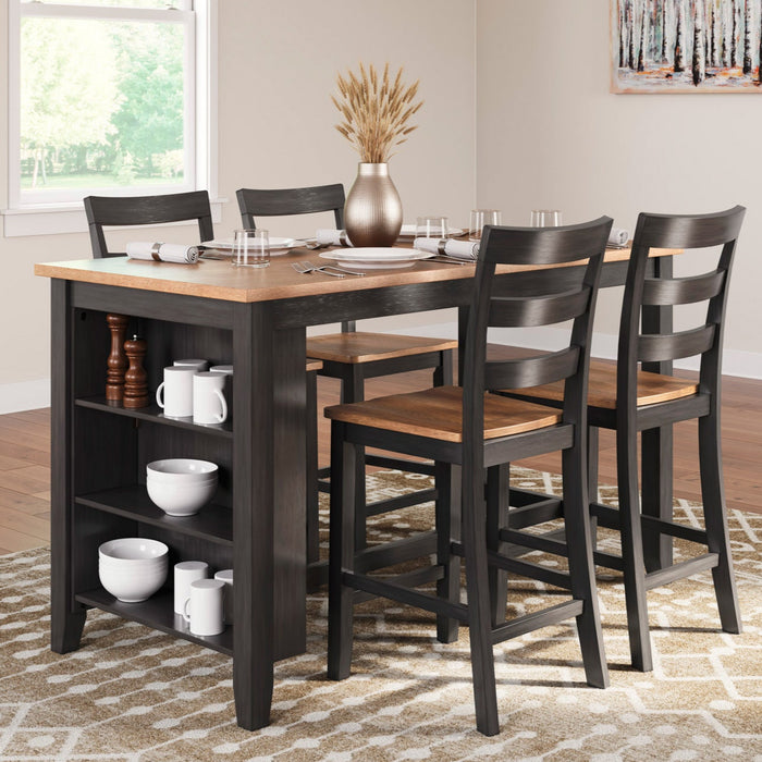 Dining room with a wooden table and chairs, rug, and pendant light.