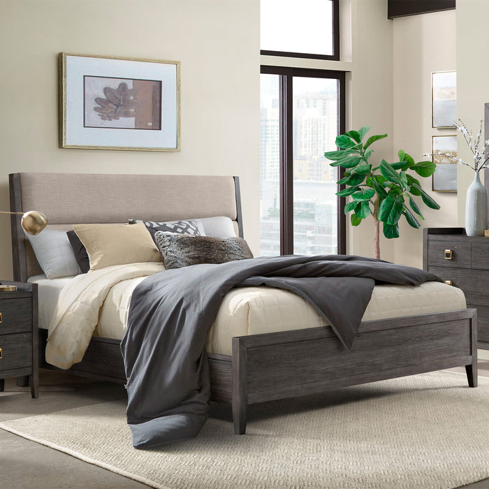 Bedroom with a wooden bed frame, gray bedding, and decorative pillows.
