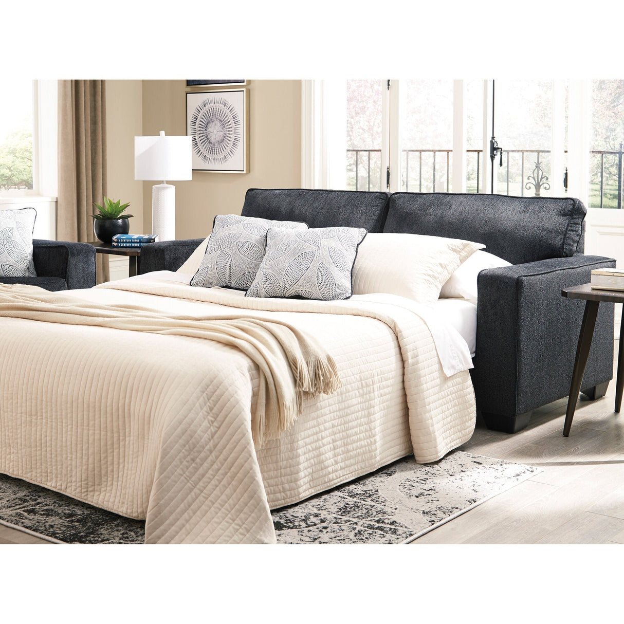 A room setting featuring Riles Slate Queen Sofa Sleeper