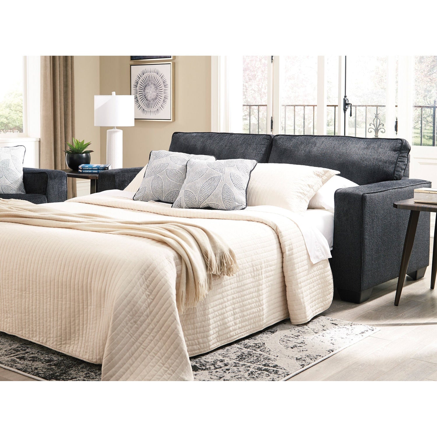 A room setting featuring Riles Slate Queen Sofa Sleeper