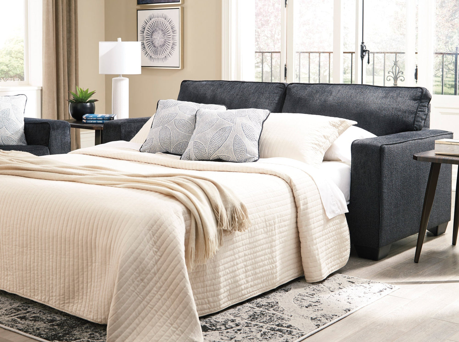 A room setting featuring Riles Slate Queen Sofa Sleeper