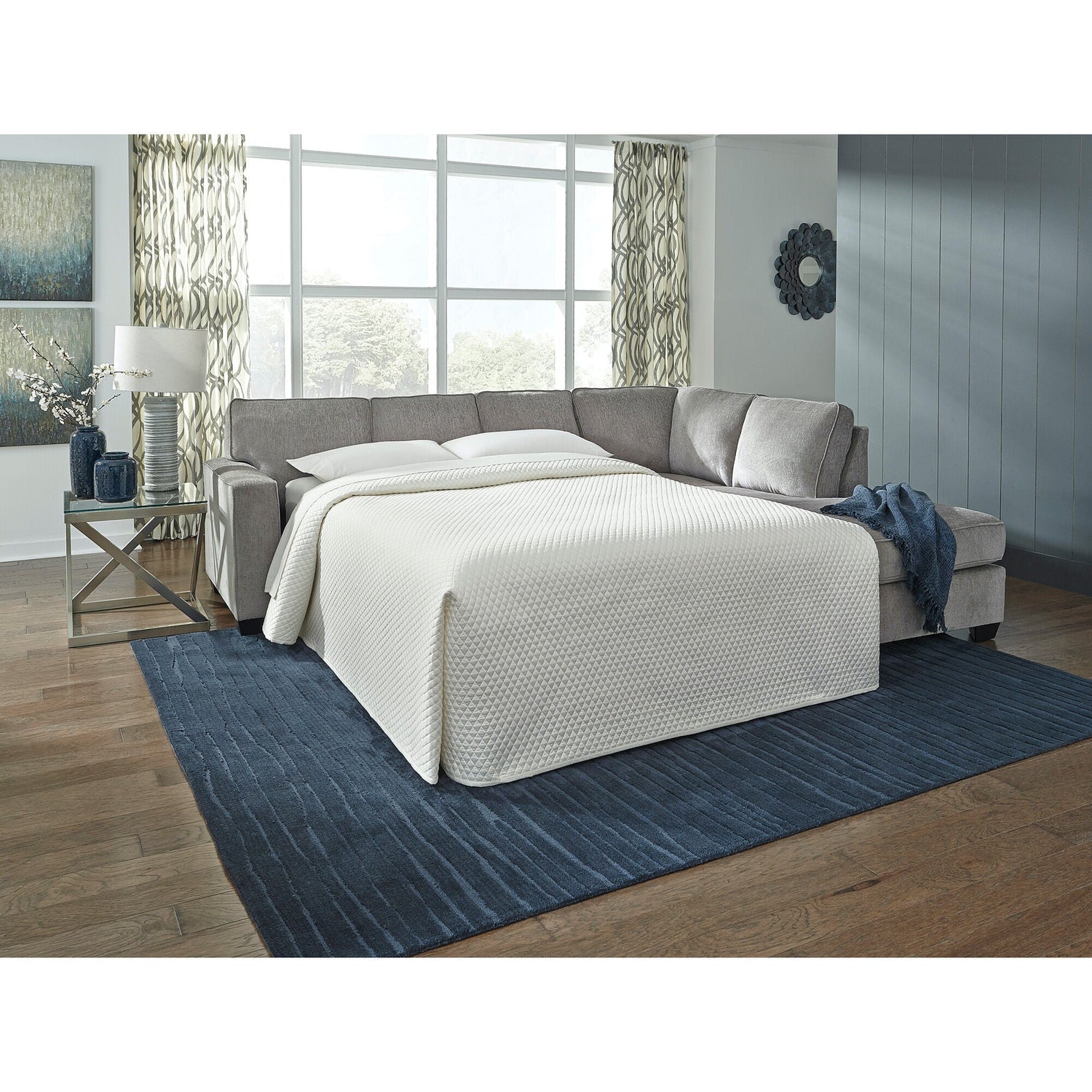 A room setting featuring Riles Alloy Right Chaise Sleeper Sectional
