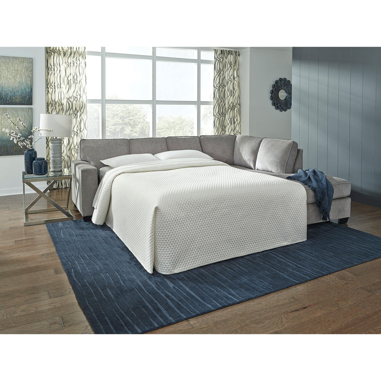A room setting featuring Riles Alloy Right Chaise Sleeper Sectional