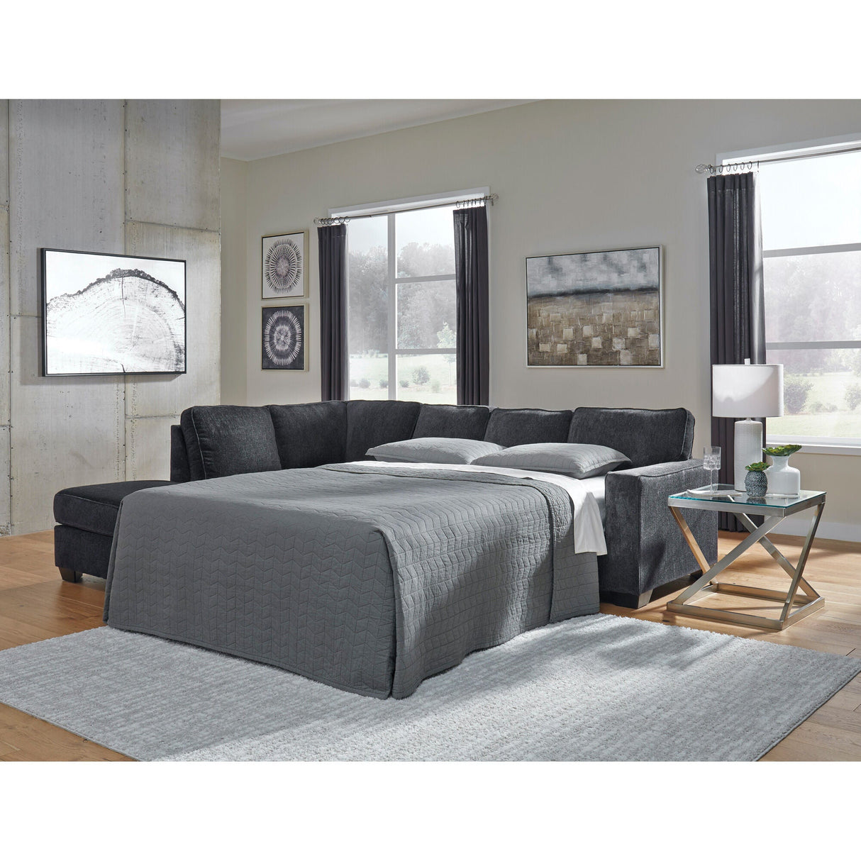 A room setting featuring Riles Slate Left Chaise Sleeper Sectional