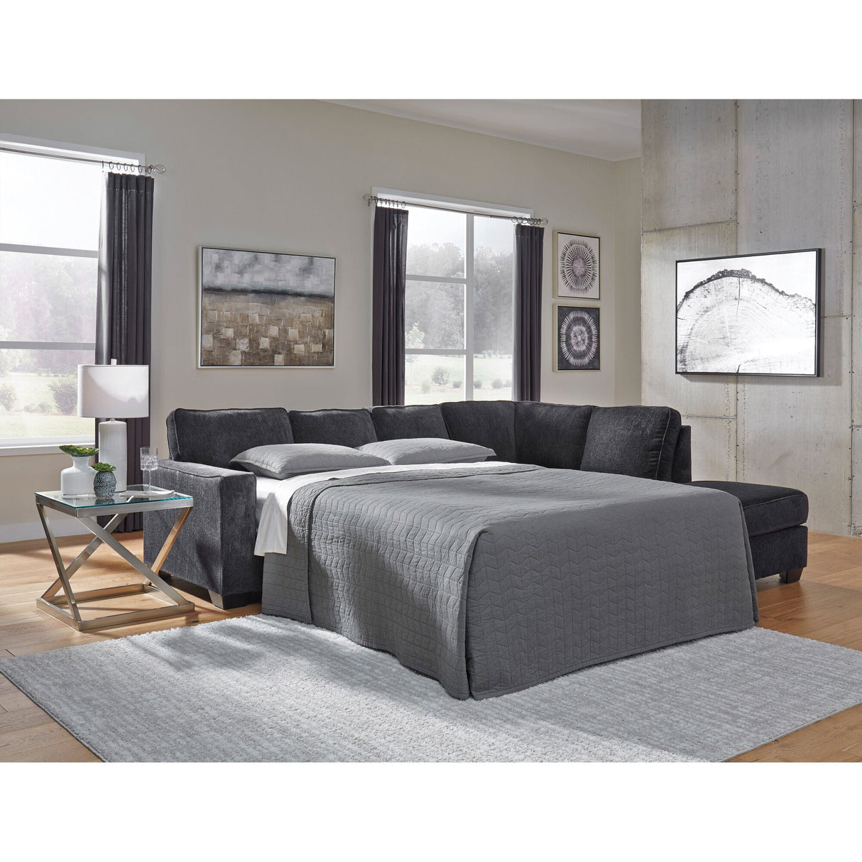 A room setting featuring Riles Slate Right Chaise Sleeper Sectional