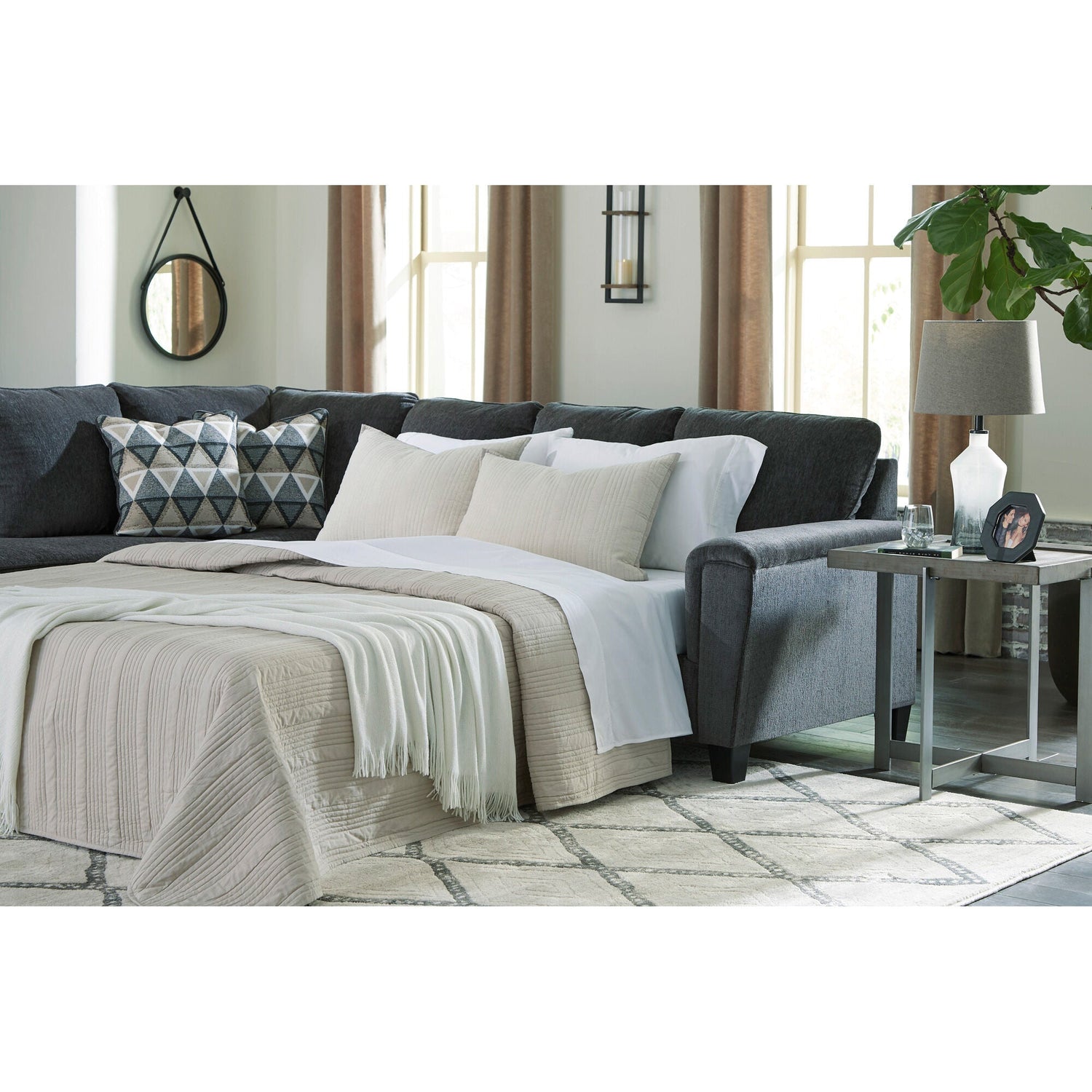 A room setting featuring Abinger Smoke Left Chaise Sleeper Sectional