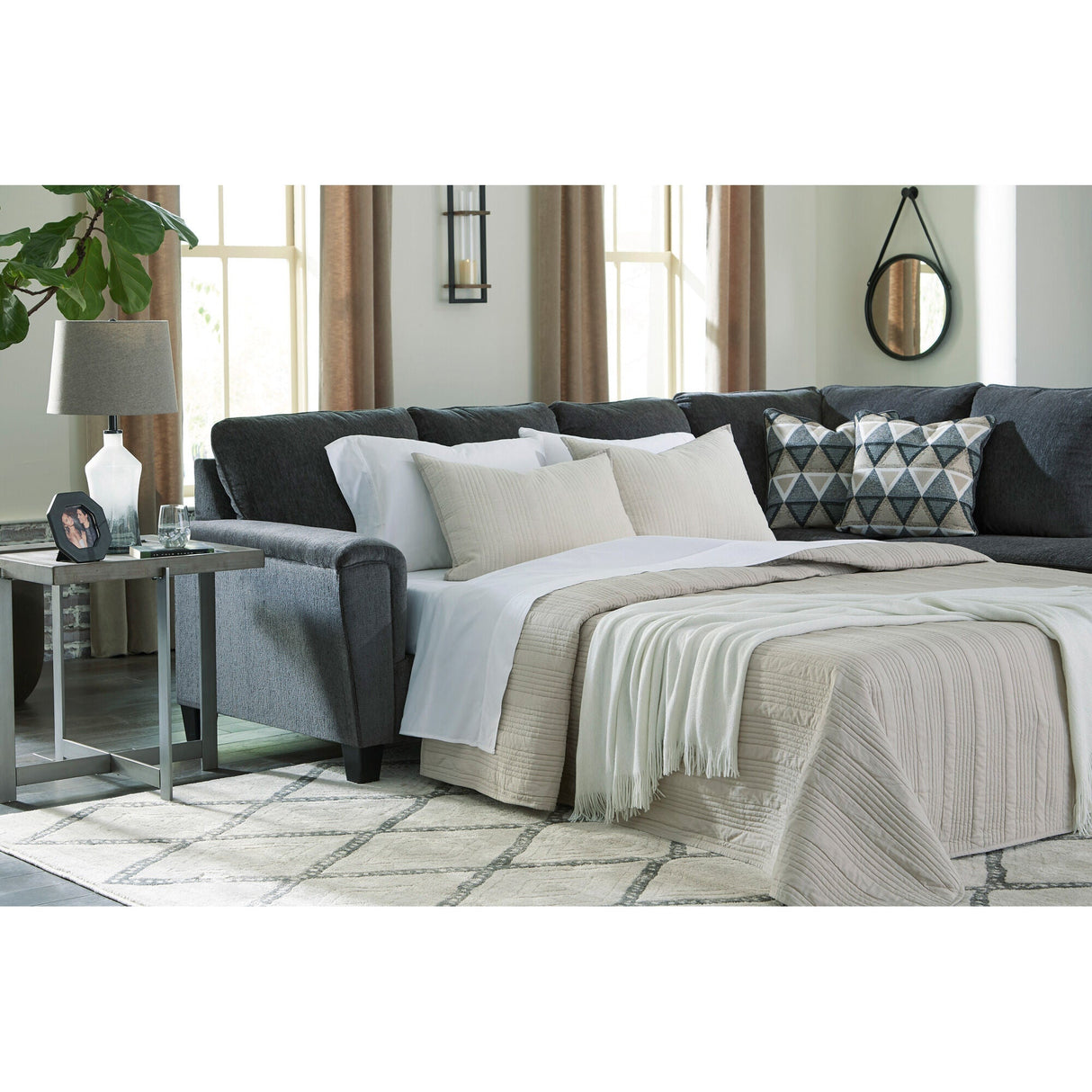 A room setting featuring Abinger Smoke Right Chaise Sleeper Sectional
