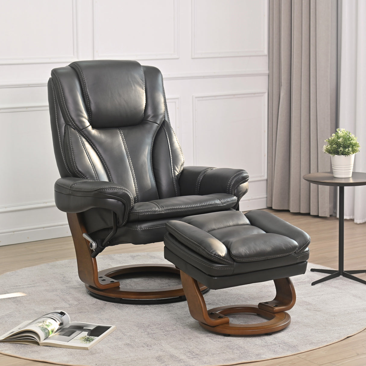 A room setting featuring Hana Gray Recliner with Ottoman
