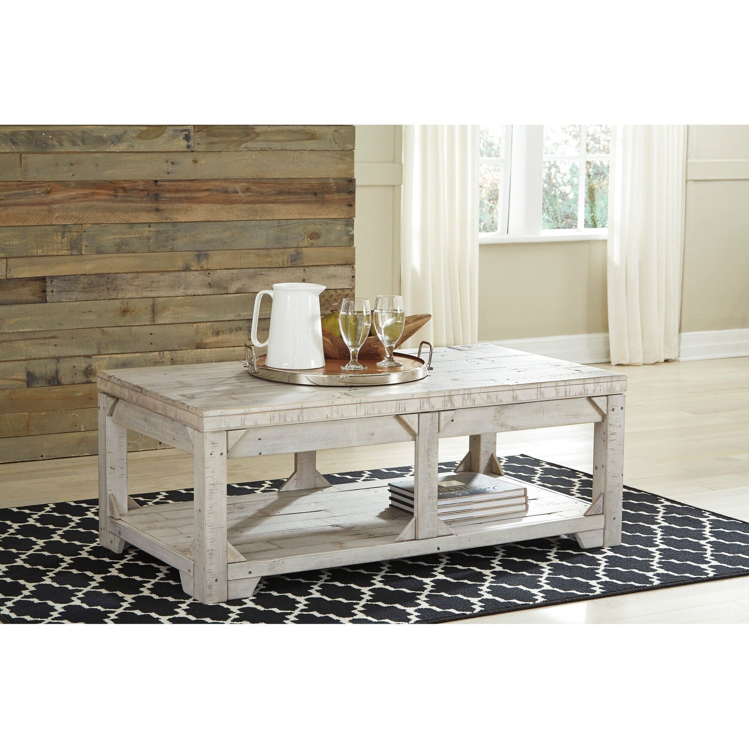 A room setting featuring Fregine Whitewash Lift Top Coffee Table
