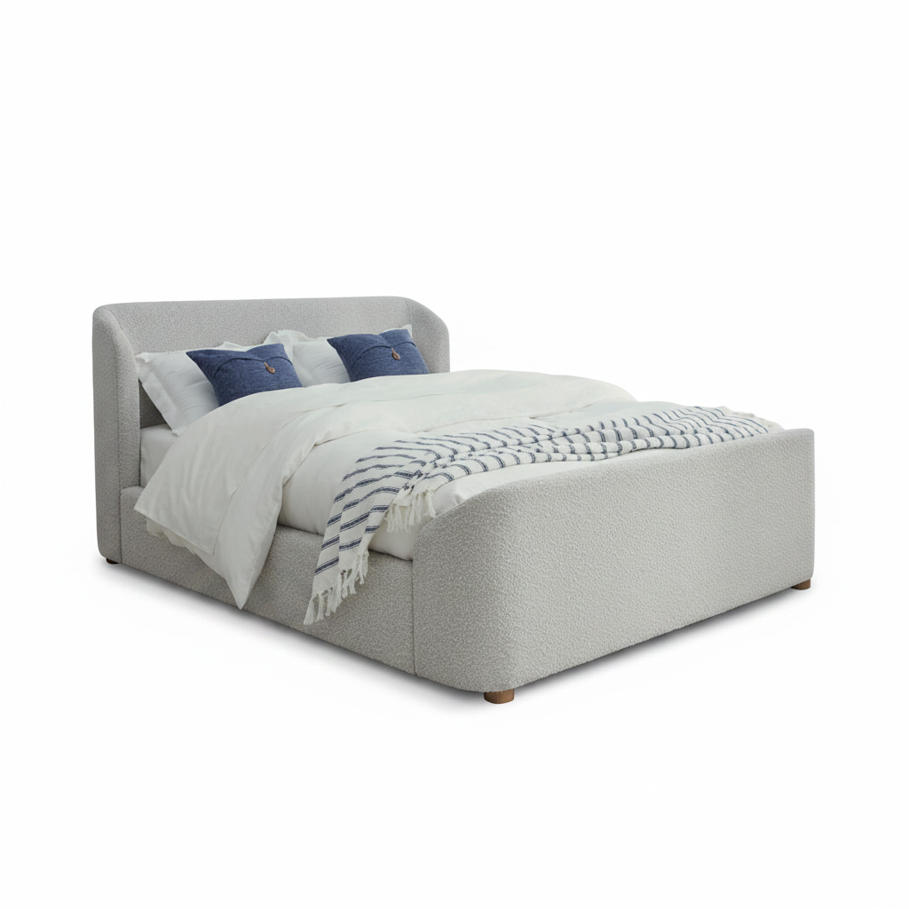 A modern upholstered bed with a textured light gray fabric, styled with white bedding, two blue accent pillows, and a blue-and-white patterned throw blanket, set against a plain white background.