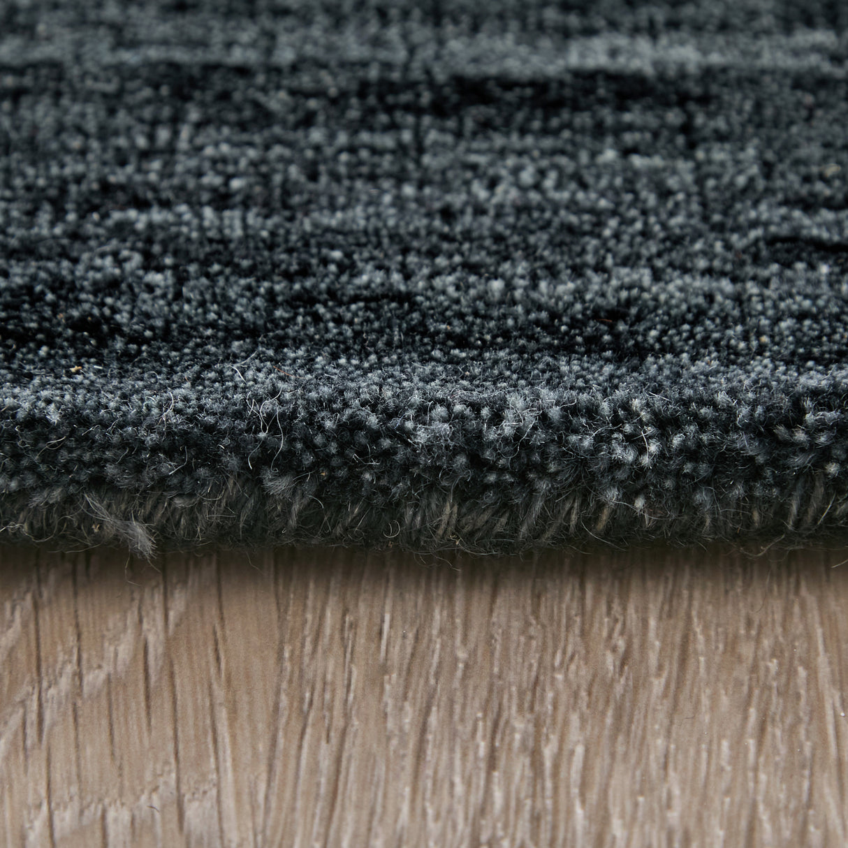 Side view of Luna Black 5x8 Rug