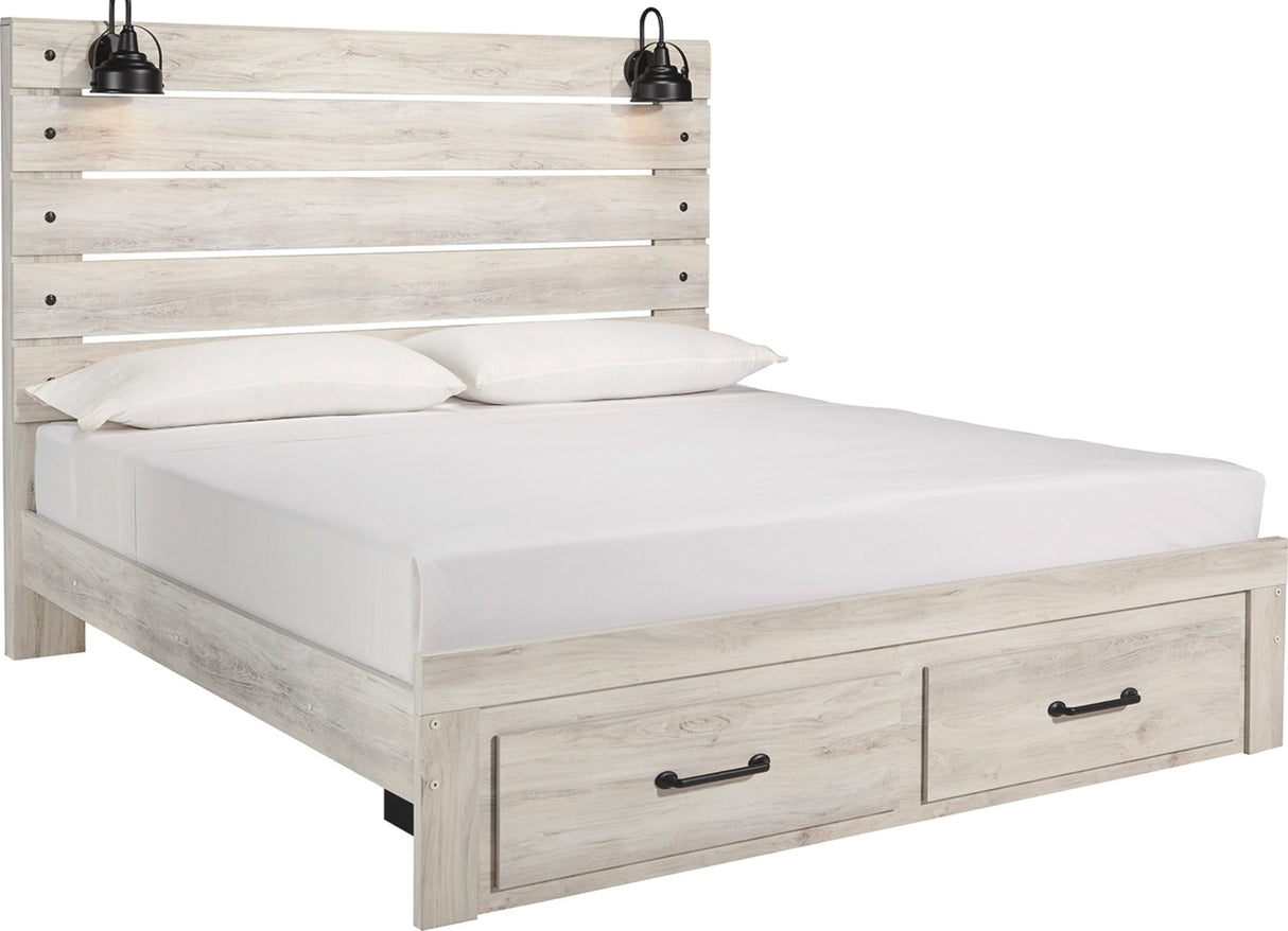 A light grayish wood platform bed frame with a slatted headboard, white mattress, two white pillows, and two built-in storage drawers with black handles at the base. Black wall-mounted lamps are attached above the headboard.