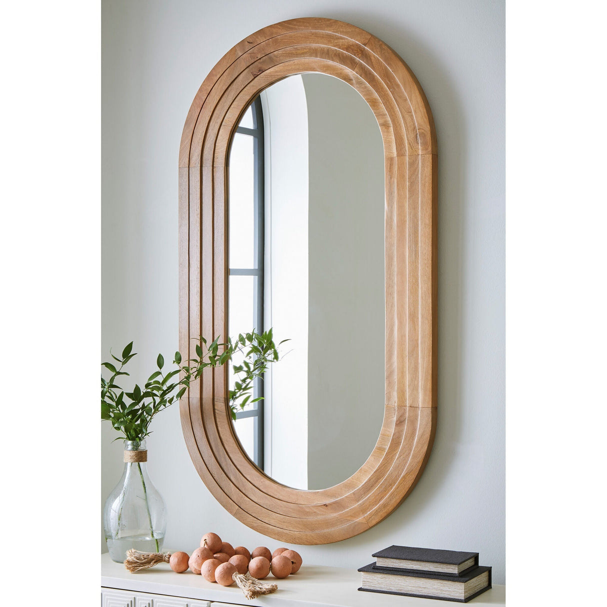 A room setting featuring Daverly Brown Accent Mirror