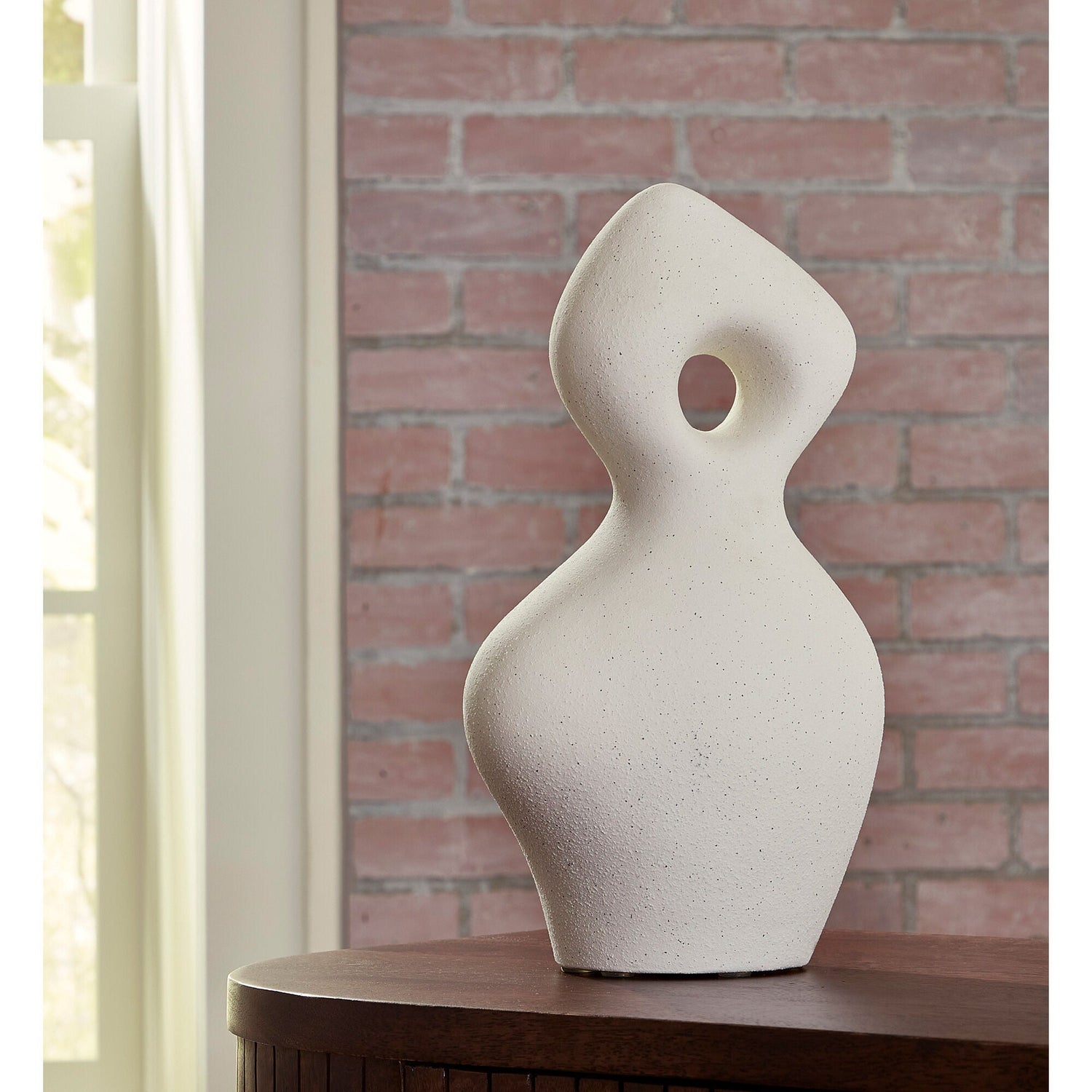 A room setting featuring Arthrow Off White Medium Sculpture