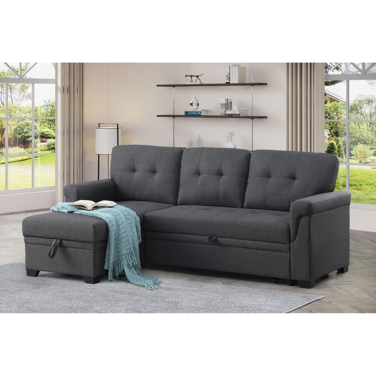 A room setting featuring Lucca Dark Gray Twin Sleeper Chaise Sofa
