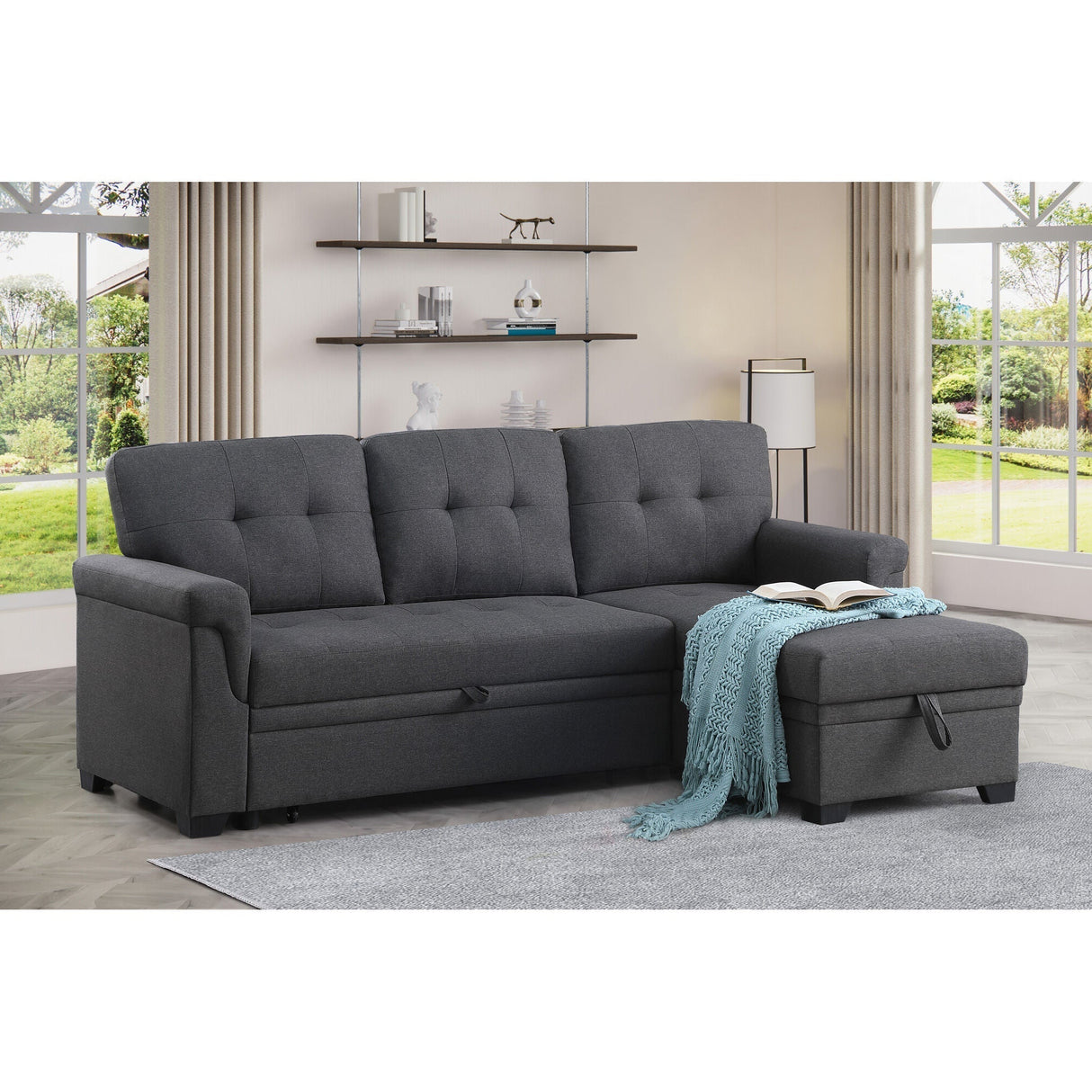 A room setting featuring Lucca Dark Gray Twin Sleeper Chaise Sofa