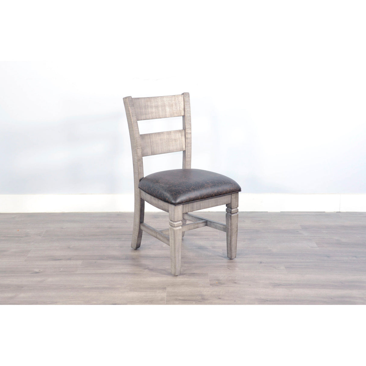 A room setting featuring Homestead Hills Alpine Gray Ladderback Chair