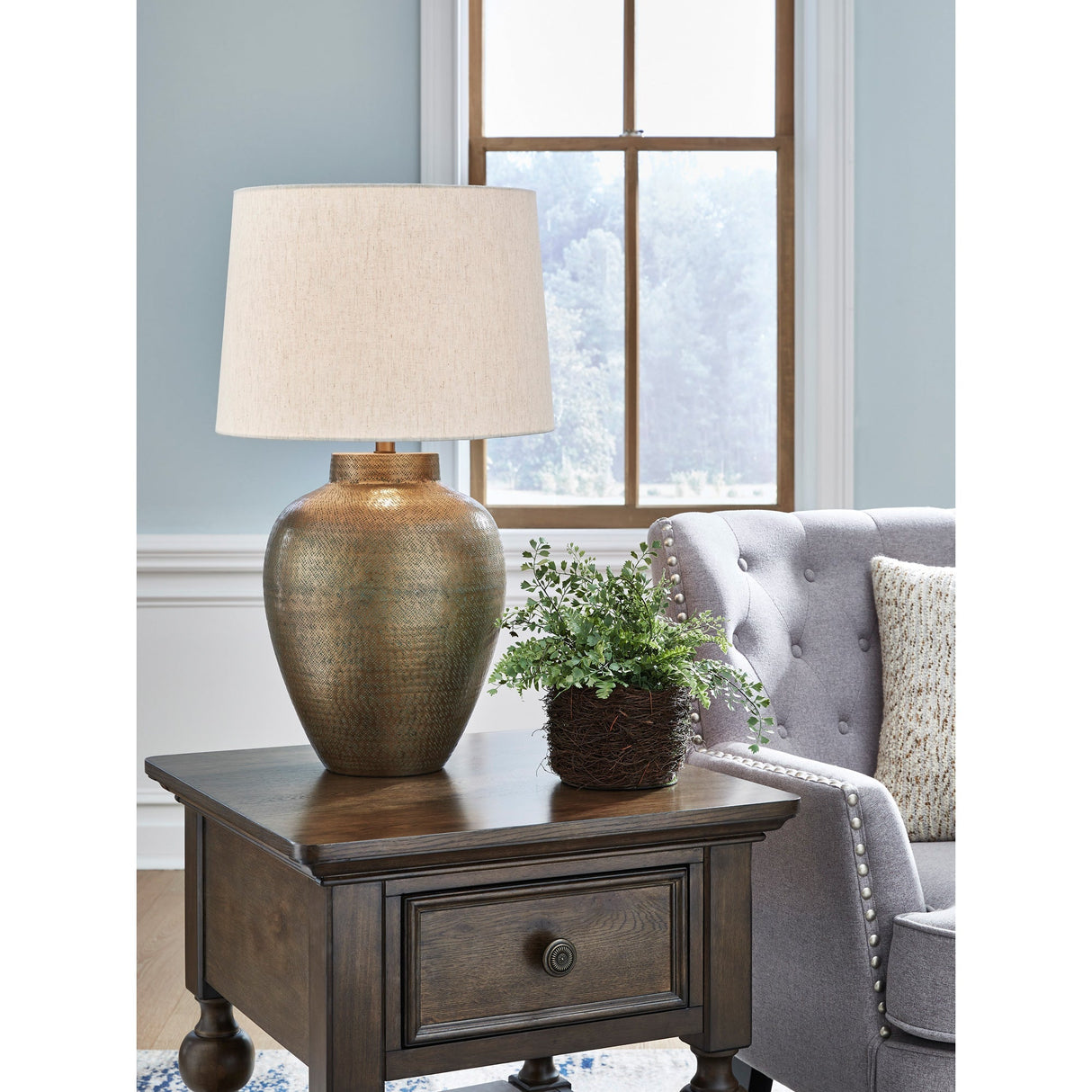 A room setting featuring Madney Antique Gold Table Lamp