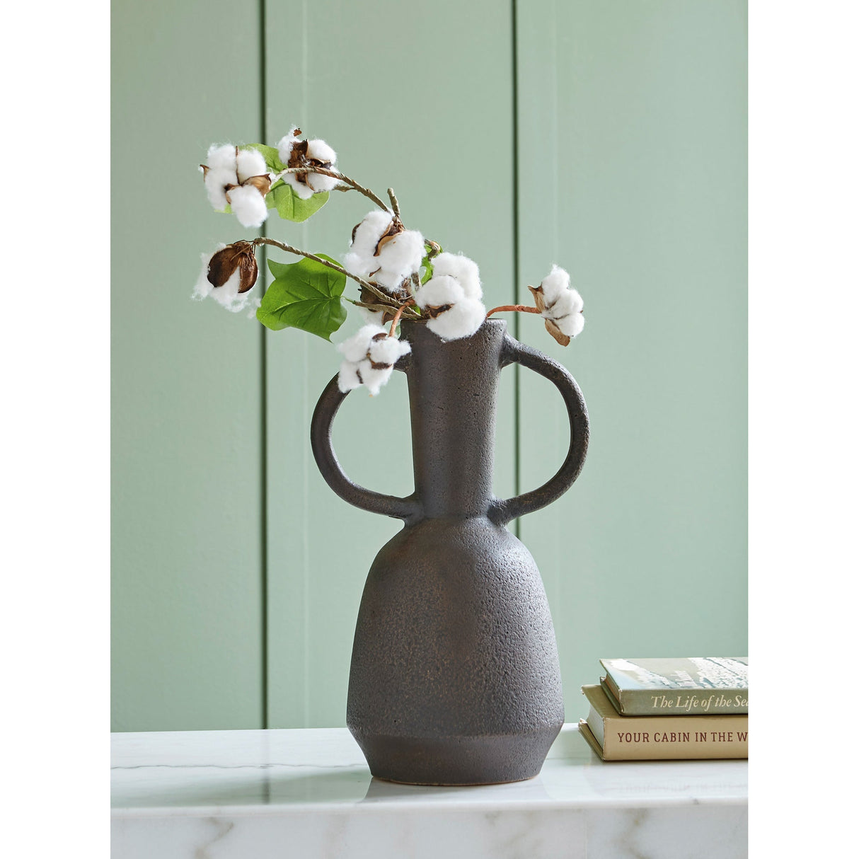 A room setting featuring Aadeen Distressed Brown Small Vase