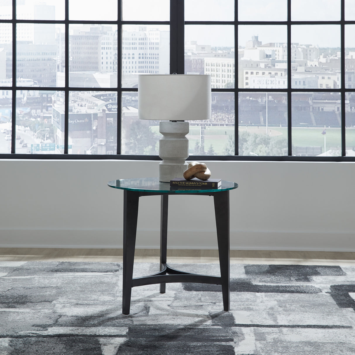 A room setting featuring Capri Glass Round End Table