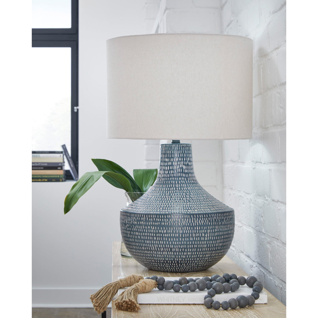 A room setting featuring Elena Cerulean Table Lamp