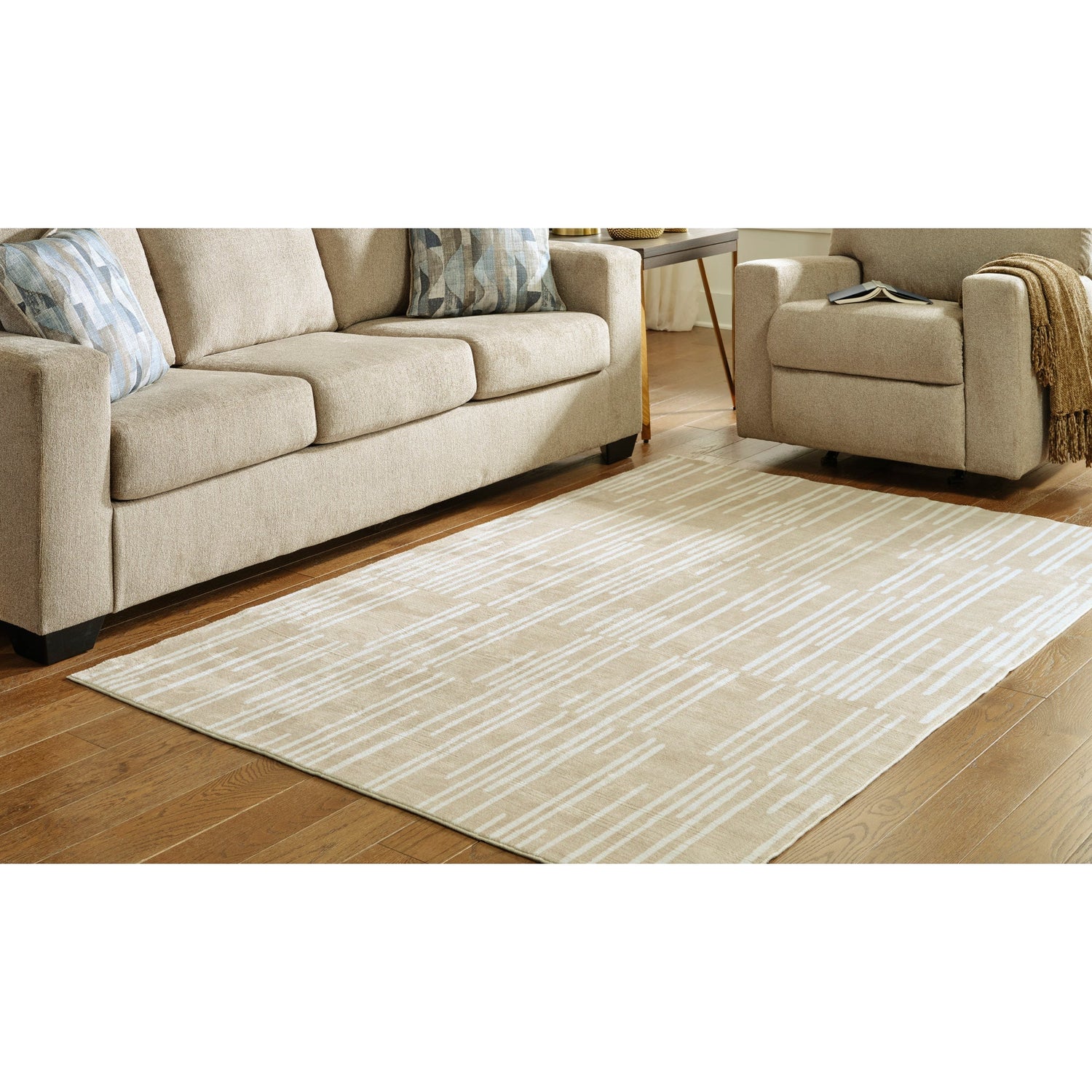 A room setting featuring Ardenville Washable Tan 5X8 Rug