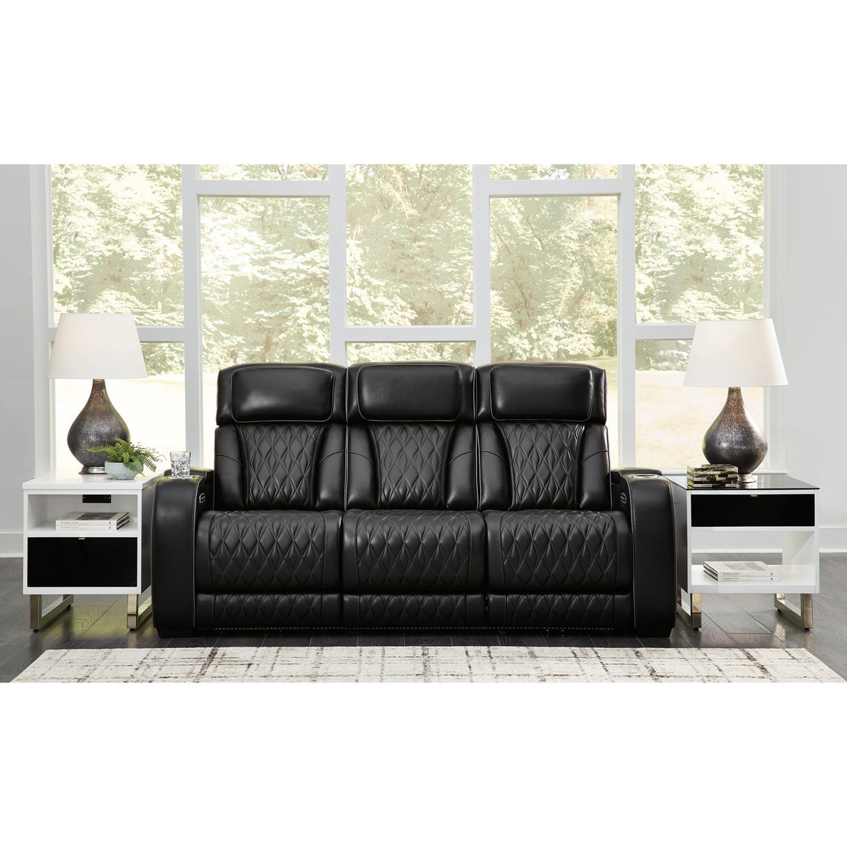 A room setting featuring Boyington Black Power Reclining Sofa