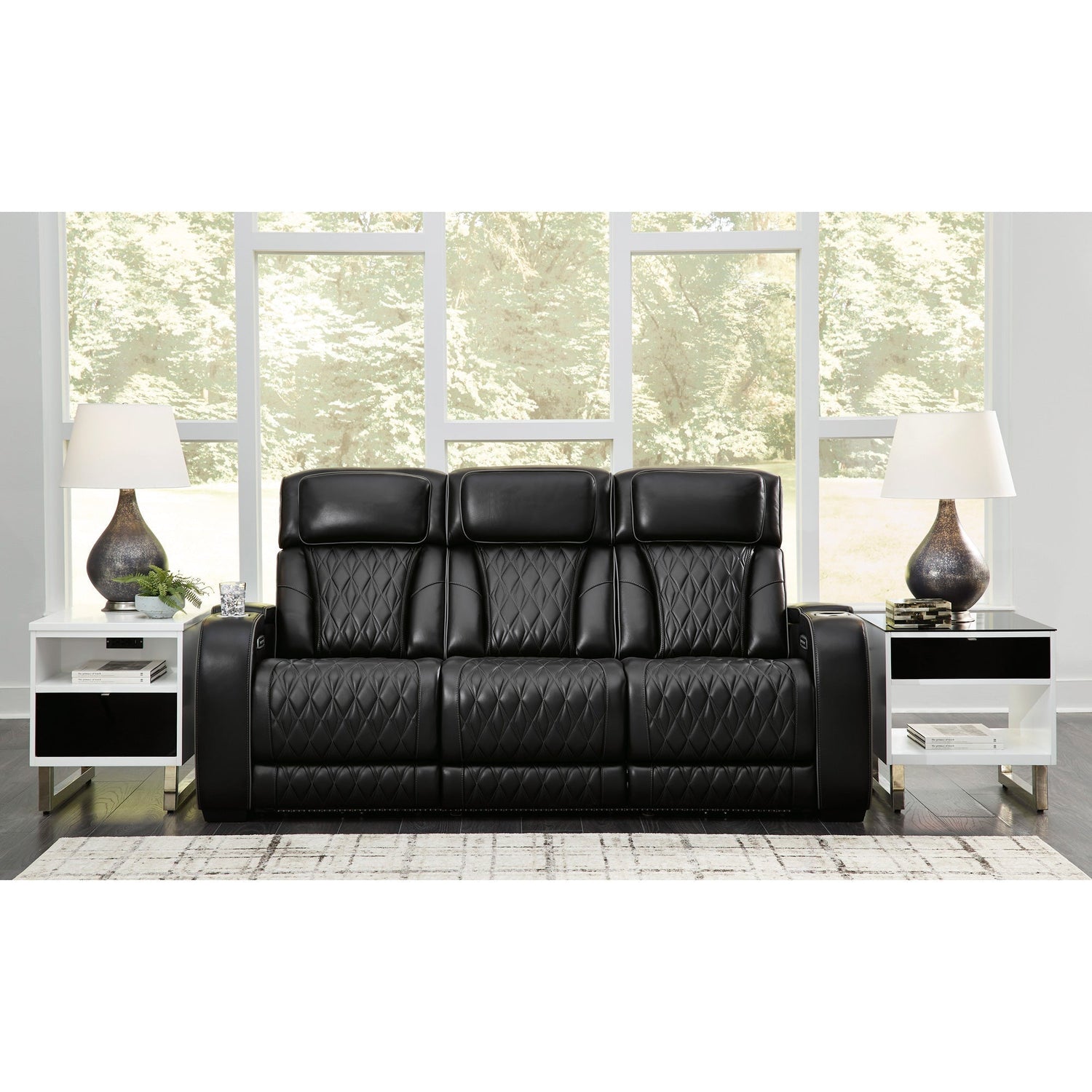 A room setting featuring Boyington Black Power Reclining Sofa