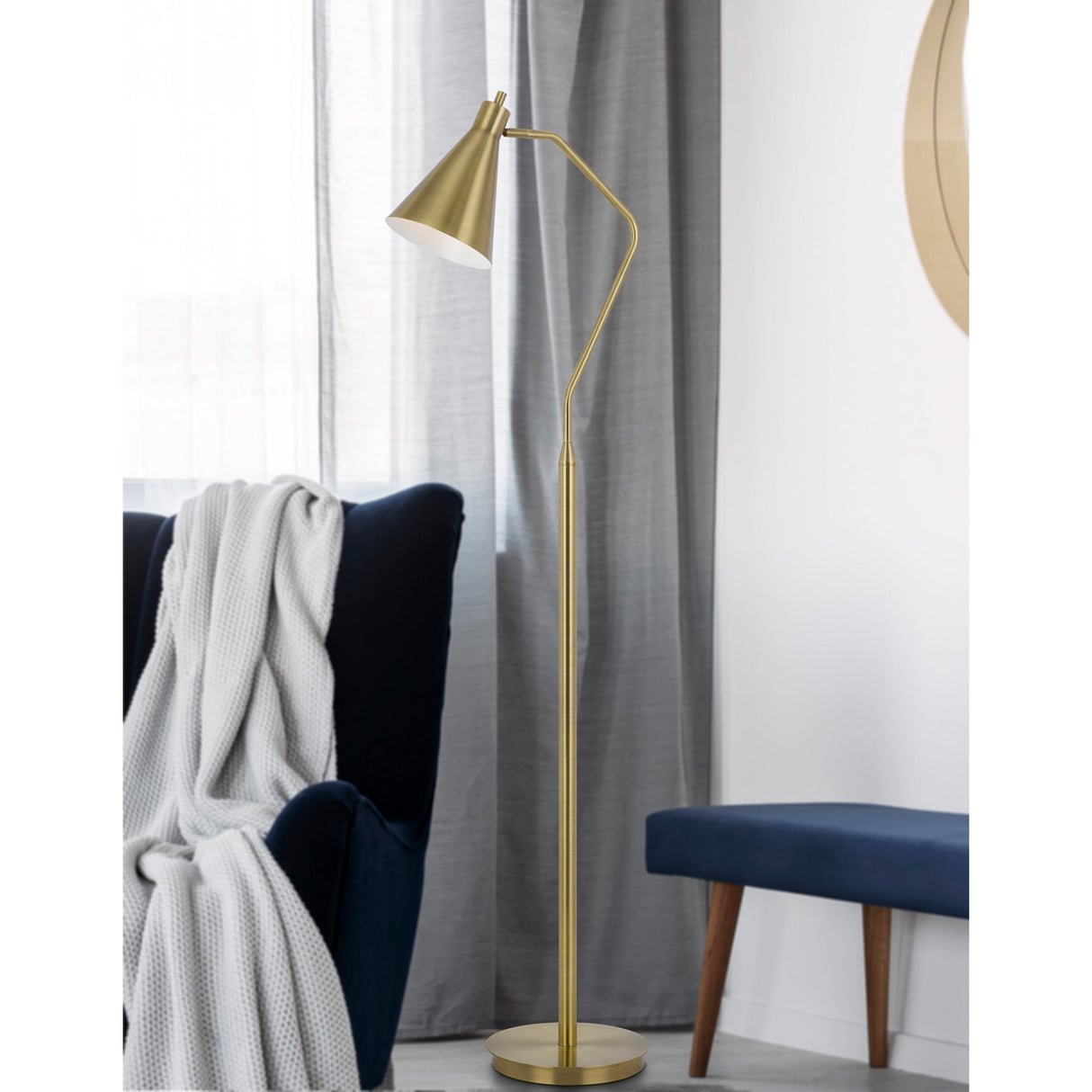 A room setting featuring Capstone Antique Brass Floor Lamp