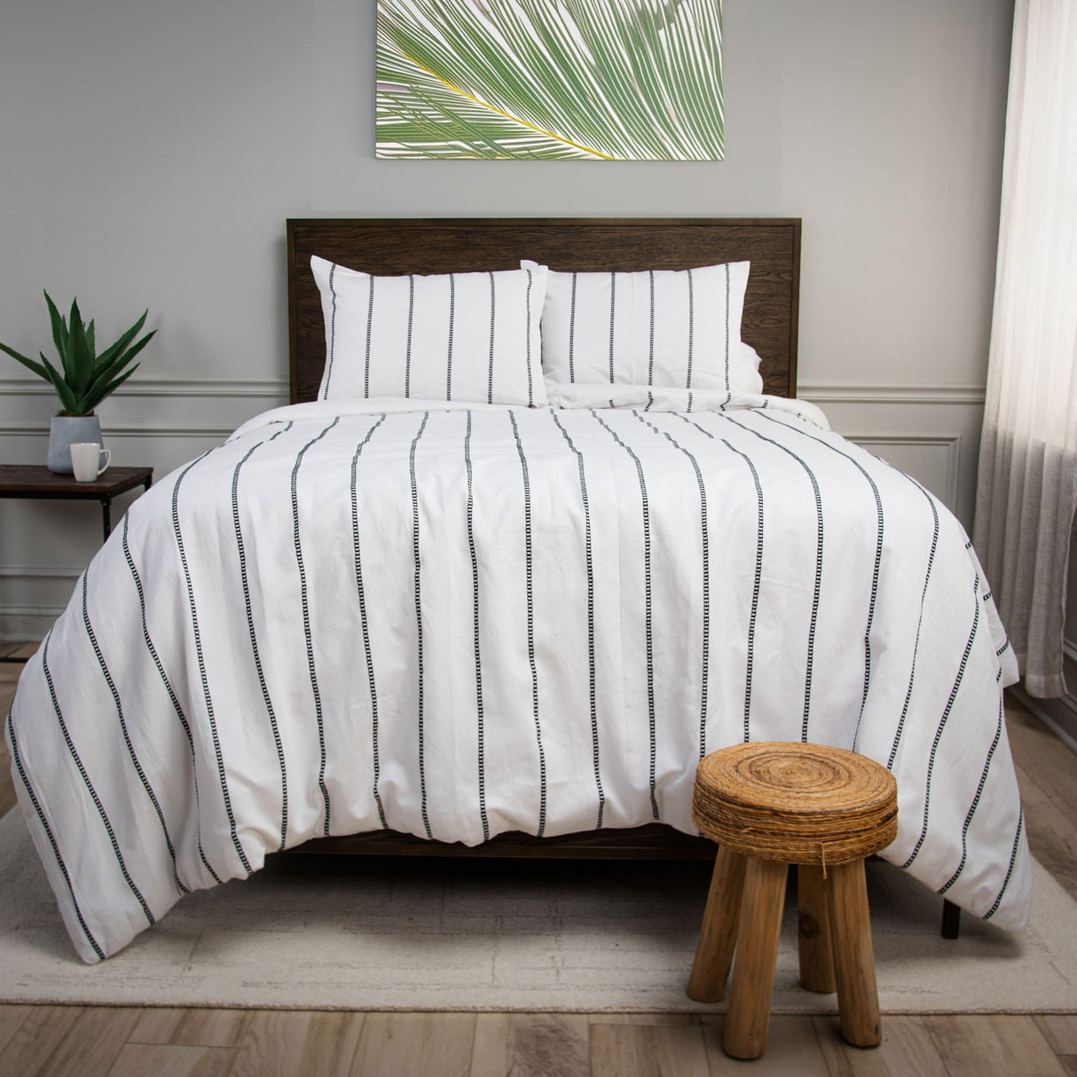 White Willow Lane Comforter and pillows on bed with stool
