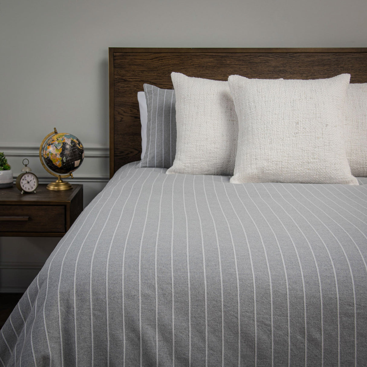 Front view of grey Willow Lane Comforter and pillows