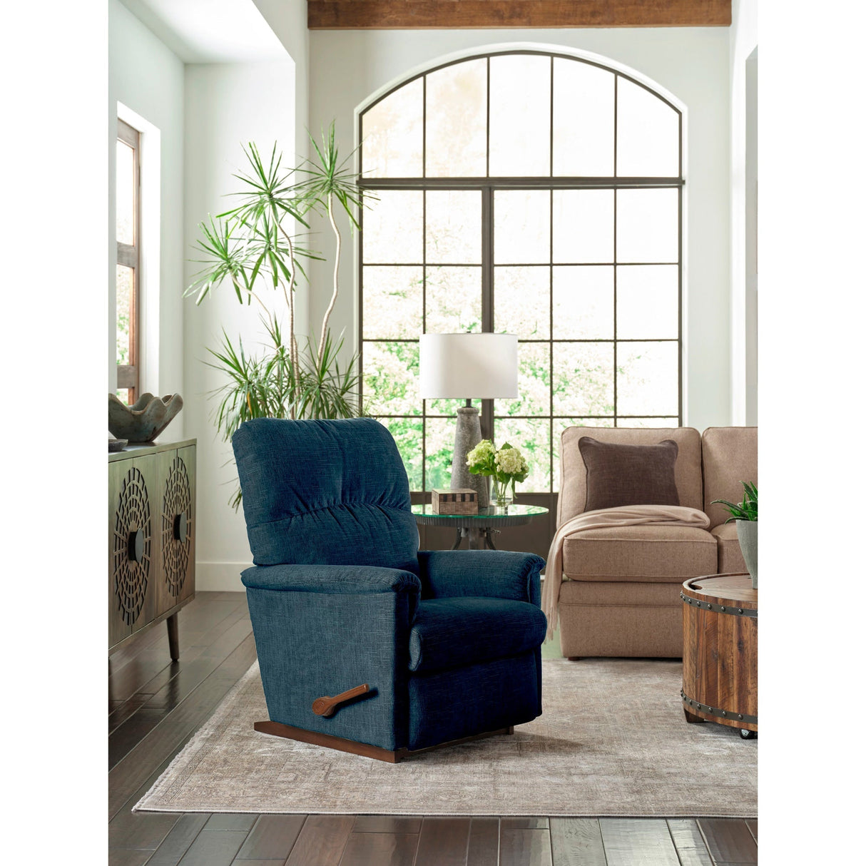 A room setting featuring Collage Navy Rocker Recliner