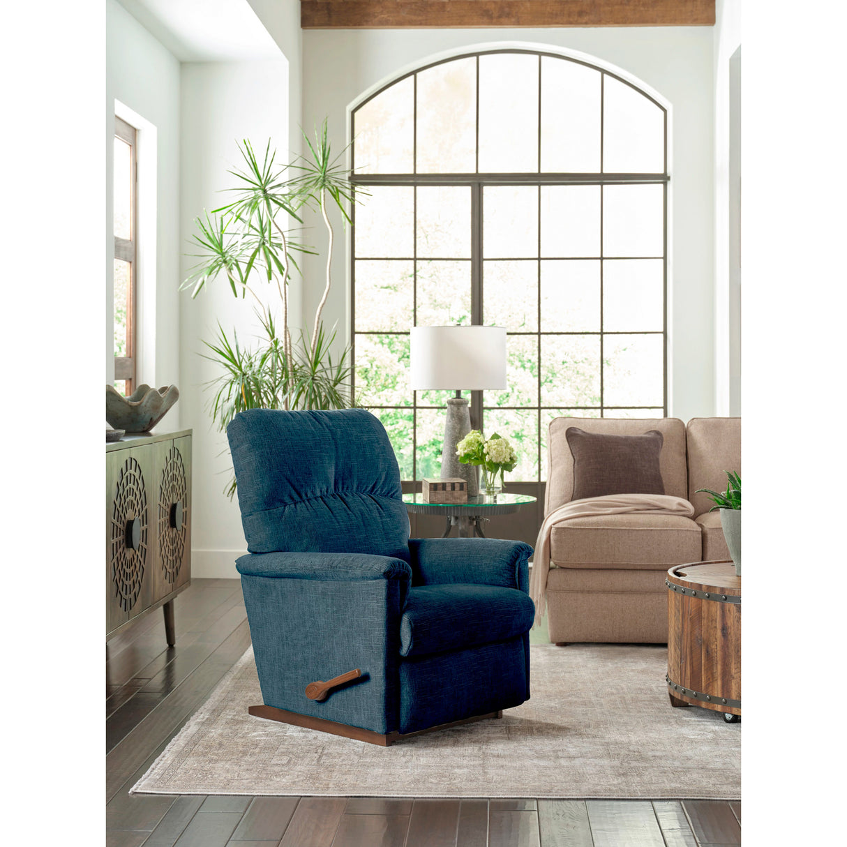 A room setting featuring Collage Navy Rocker Recliner