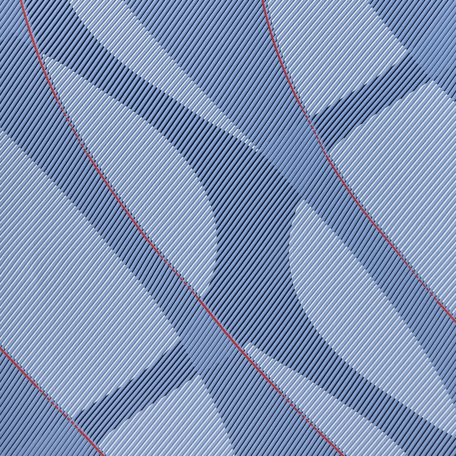 Close-up of a blue fabric with red stitching