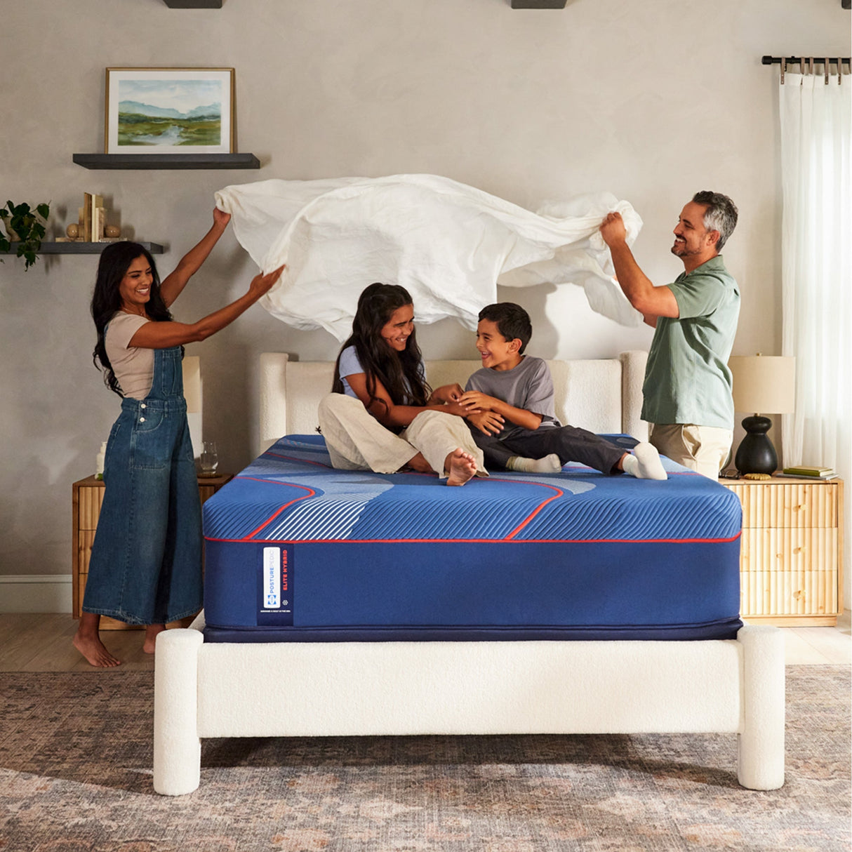 A room setting featuring Sealy Posturepedic Elite Brenham II Firm Hybrid Full Mattress
