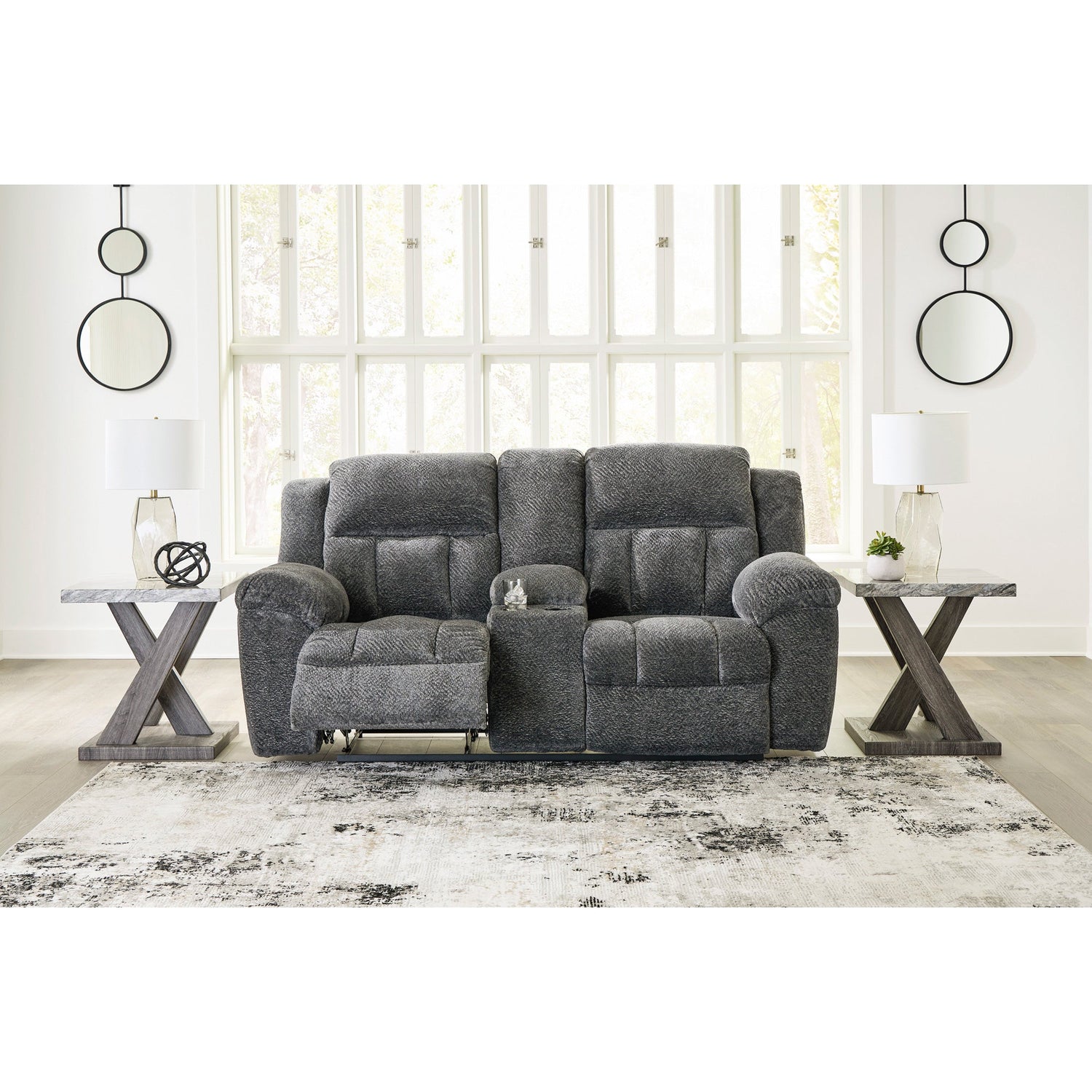 A room setting featuring Frohn Graphite Console Reclining Loveseat