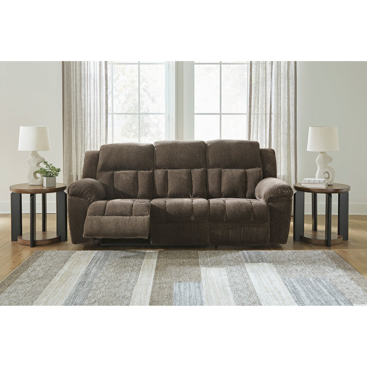 A room setting featuring Frohn Chocolate Reclining Sofa