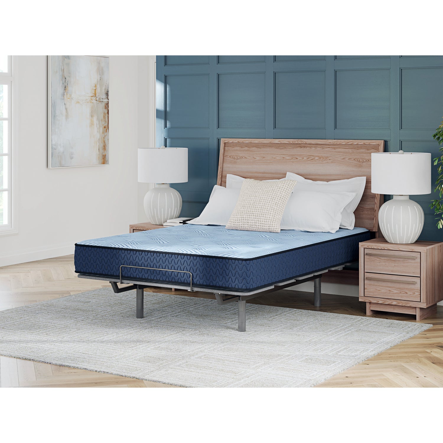 Blue mattress on a bed in a bedroom with wooden headboard and nightstands.