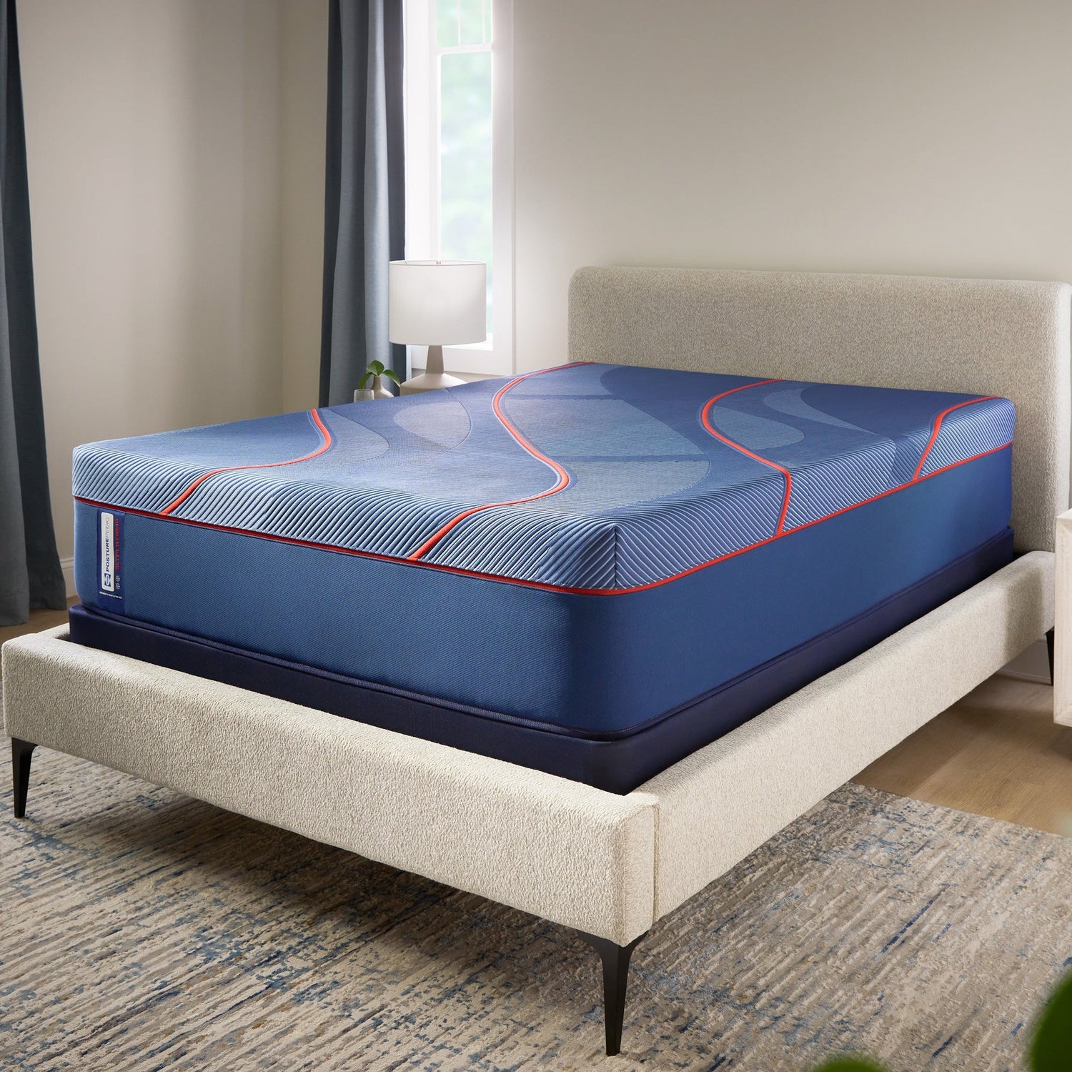 A room setting featuring Sealy Posturepedic Elite High Point II Soft Hybrid Split California King Mattress