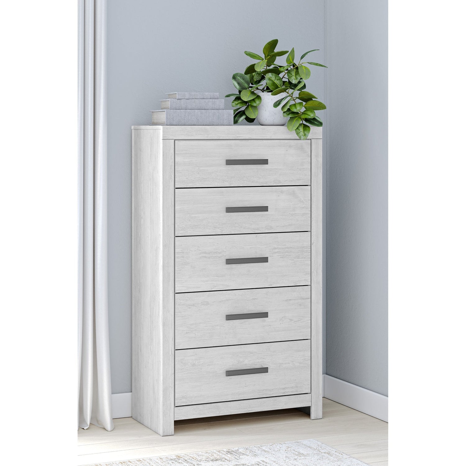 A room setting featuring Cayboni White Chest