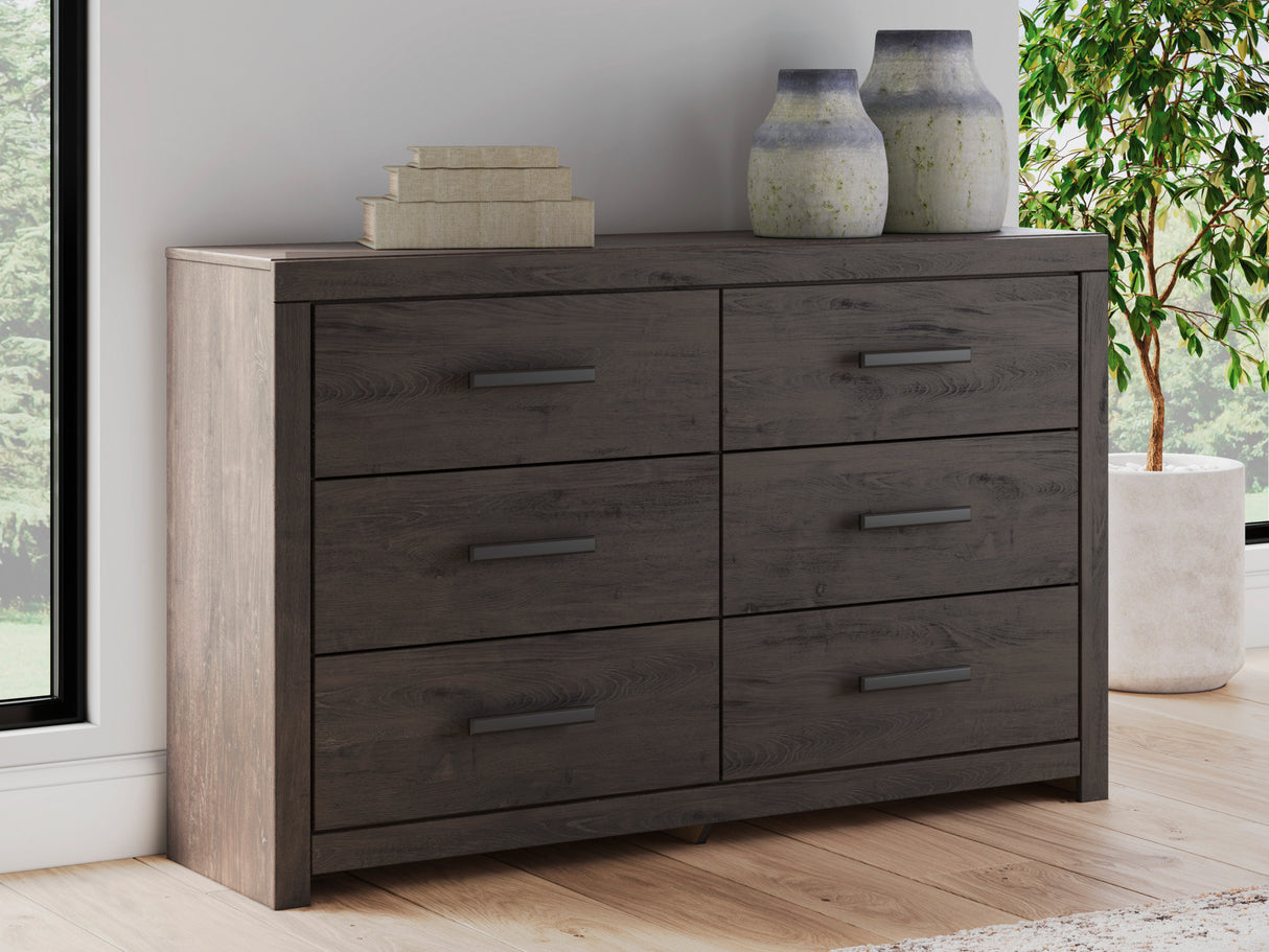 A room setting featuring Prendonea Charcoal Dresser