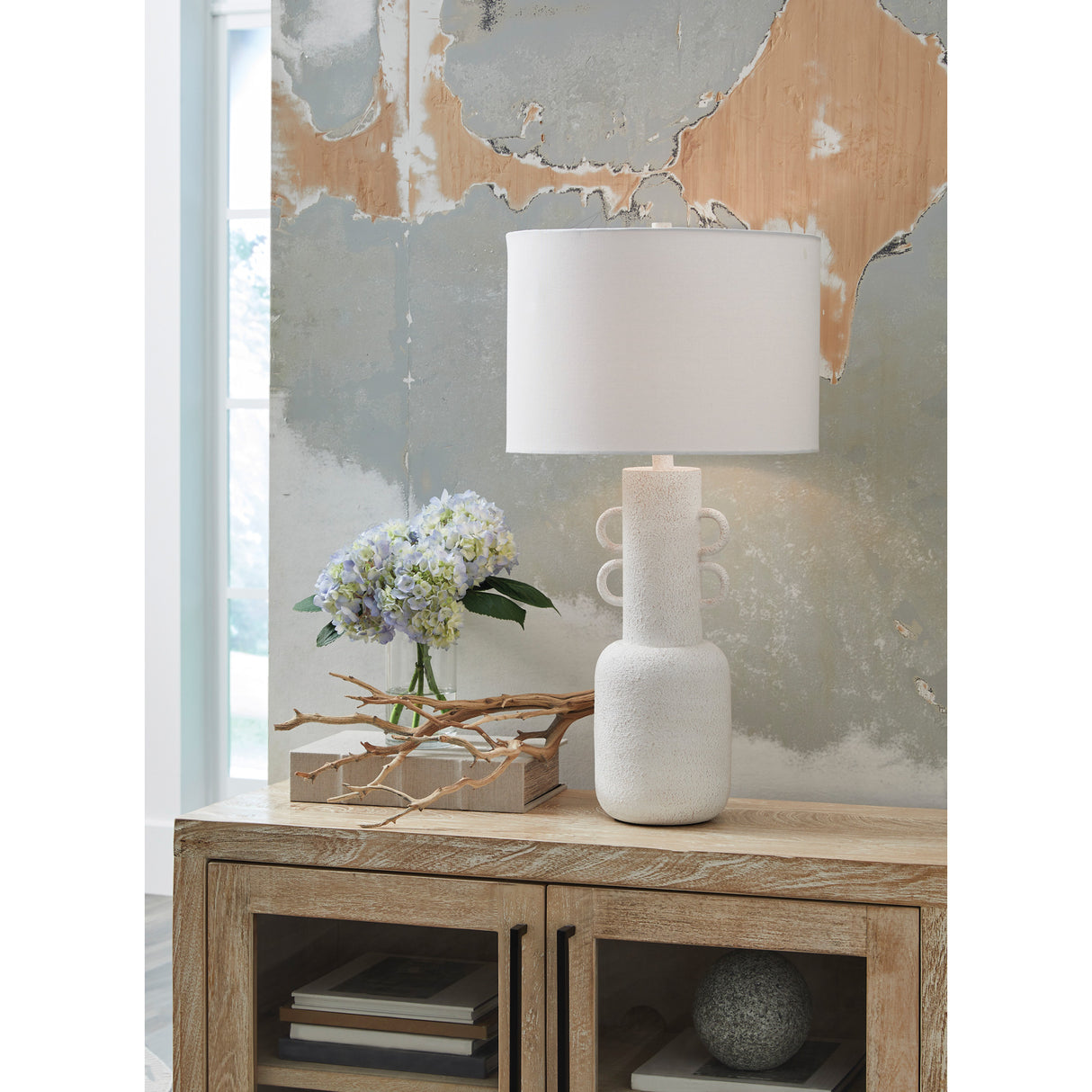 A room setting featuring Perringhill Distressed White Table Lamp